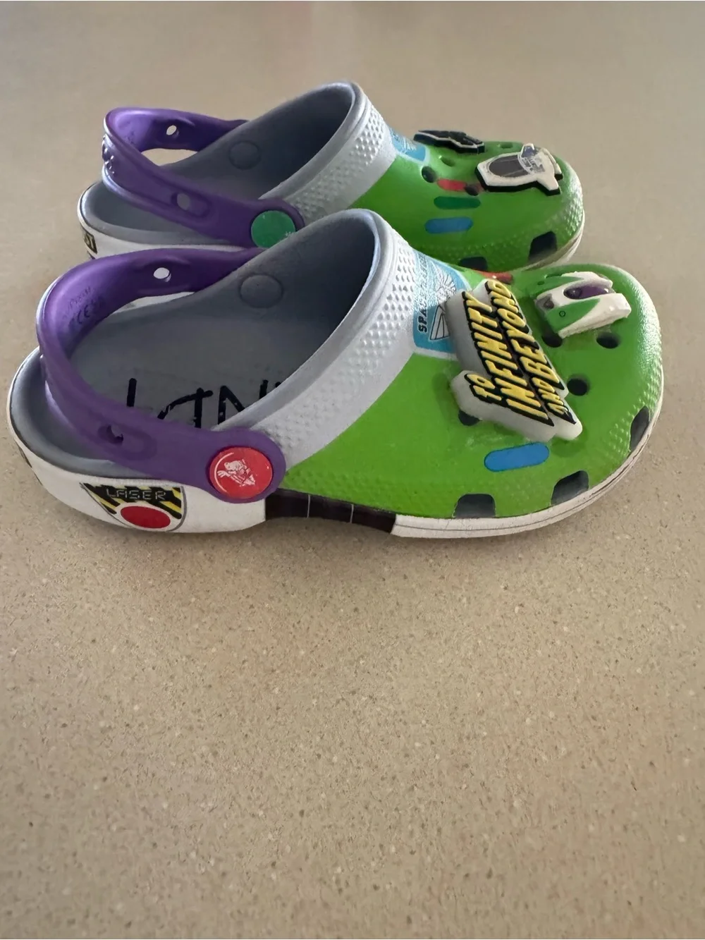CROCS Kids Green Clogs with Purple Heel Strap and Space Charms